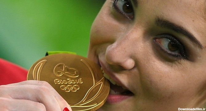 چرا قهرمانان المپیک مدال‌های طلایشان را گاز می گیرند؟ (+عکس)