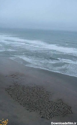 نقاشی روی شن ساحل دریا - تصاوير بزرگ - جهان نيوز