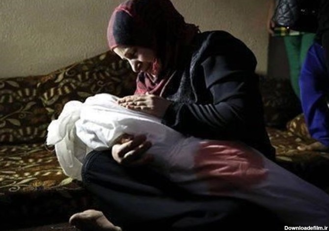 مادر فلسطینی با کودک شهیدش چه می گوید+عکس - تسنیم
