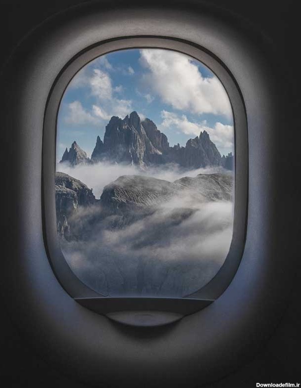 تصویر نمای کوهستان از پنجره هواپیما | تیک طرح مرجع گرافیک ایران