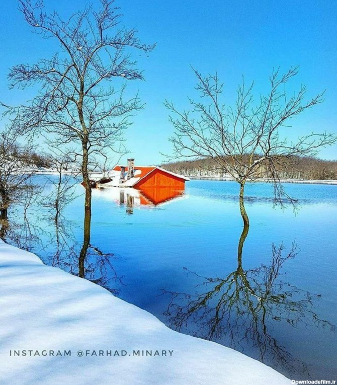 منظره زیبای دریاچه سقالکسارِ رشت در زمستان خانه غرق شده‌ای که در ...