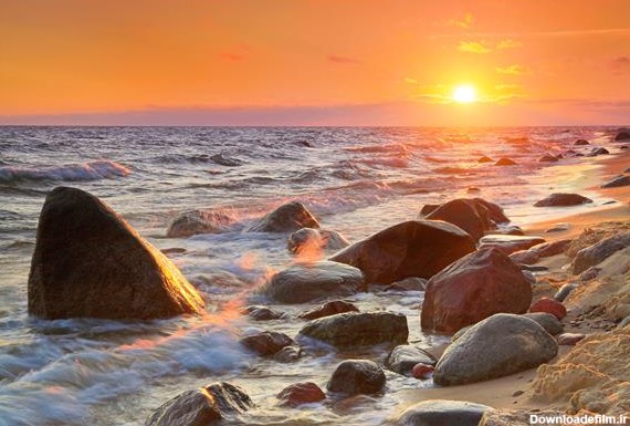 دریا و سنگ های بزرگ در غروب خورشید از وب سایت آلامی - faa679