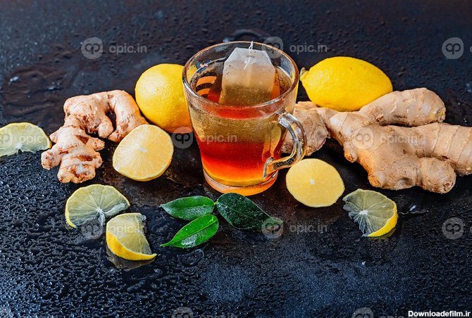 دانلود عکس یک فنجان چای داغ با لیمو و ریشه زنجبیل تازه | اوپیک