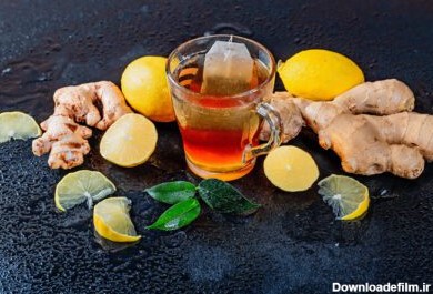 دانلود عکس یک فنجان چای داغ با لیمو و ریشه زنجبیل تازه