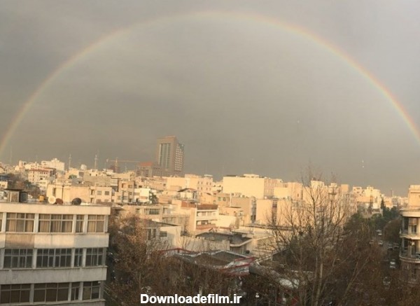 پدیده کم‌نظیر رنگین کمان در تهران + عکس