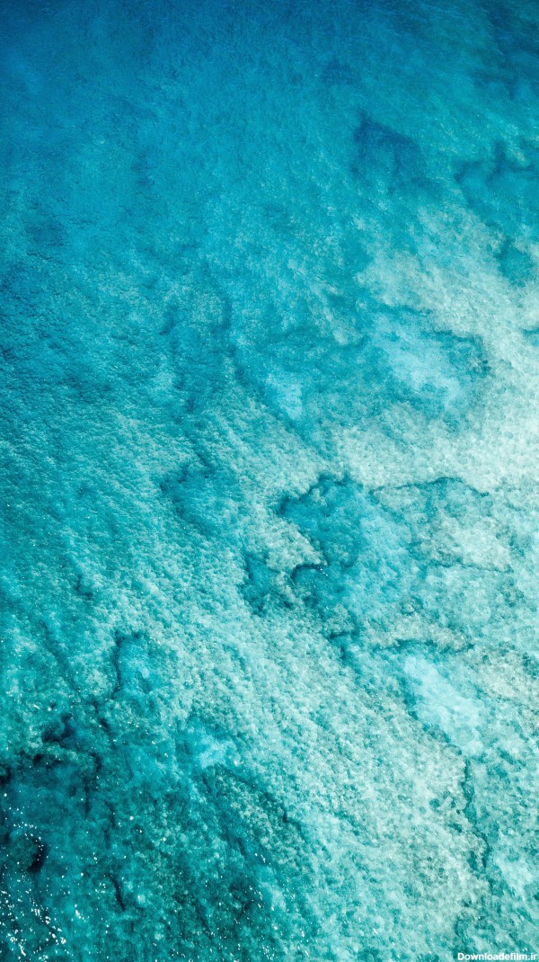عکس زمینه اقیانوس سبز و آبی زلال و شفاف پس زمینه | والپیپر گرام