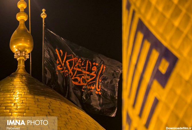 عکس تعویض پرچم حرم امام حسین