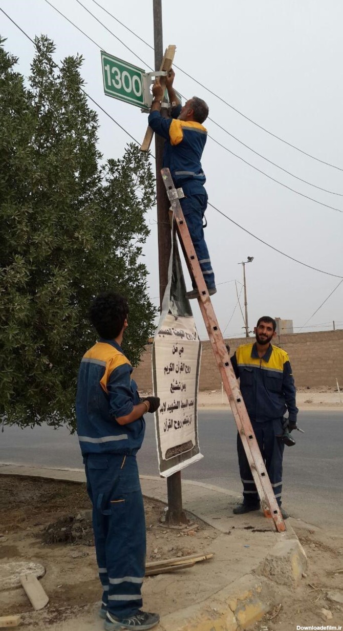 تعویض تابلوهای «شماره عمود» مسیر کربلا توسط خادمان ایرانی (+عکس)