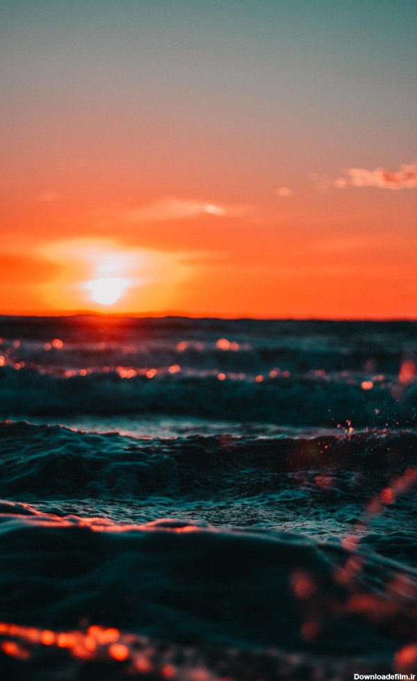 عکس زمینه نمای اقیانوس در غروب آفتاب پس زمینه | والپیپر گرام