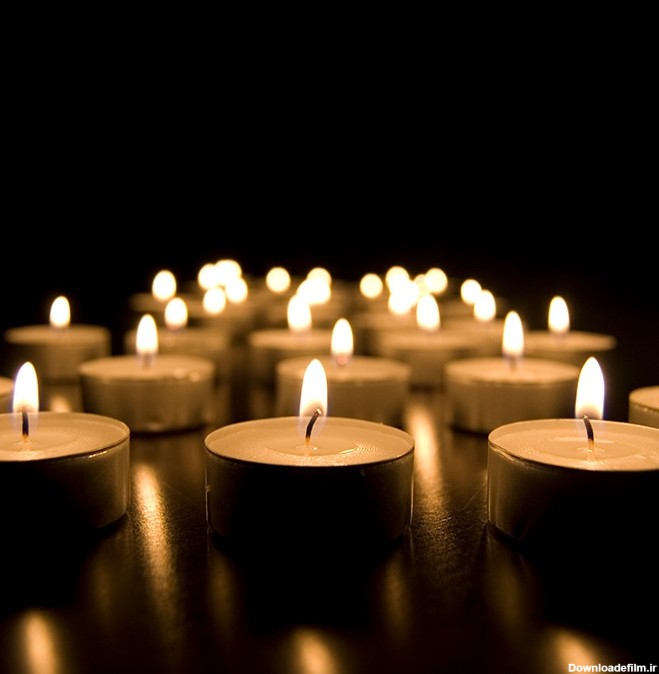 عکس با کیفیت شمع‌های روشن و درحال سوختن - نقشینو