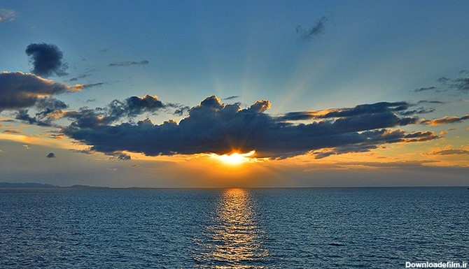 تصویر پس زمینه ابر و غروب خورشید روی دریای آرام | فری پیک ...