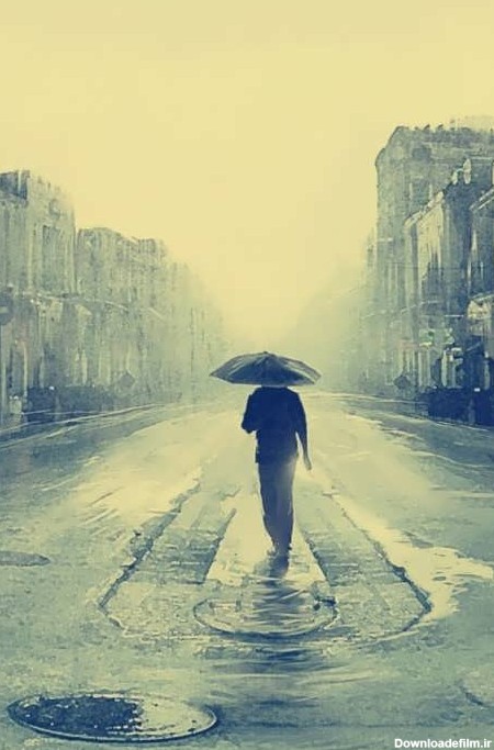 عکس زیبای پسر تنها در زیر باران