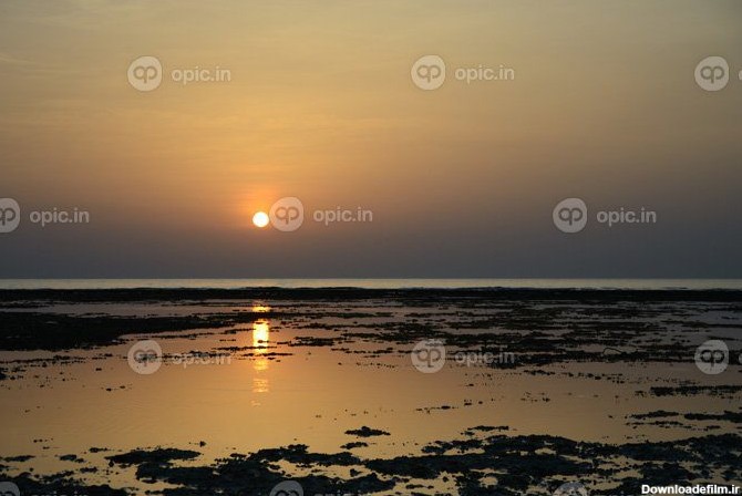 دانلود عکس طلوع خورشید در دریا با انعکاس | اوپیک
