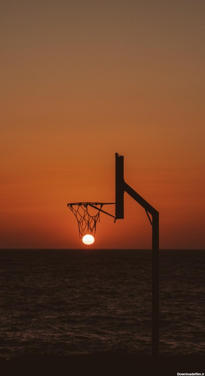 عکس زمینه غروب خورشید در سبد بسکتبال پس زمینه | والپیپر گرام