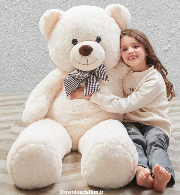 عکس بزرگترین خرس عروسکی تدی سفید در بغل دختر بچه