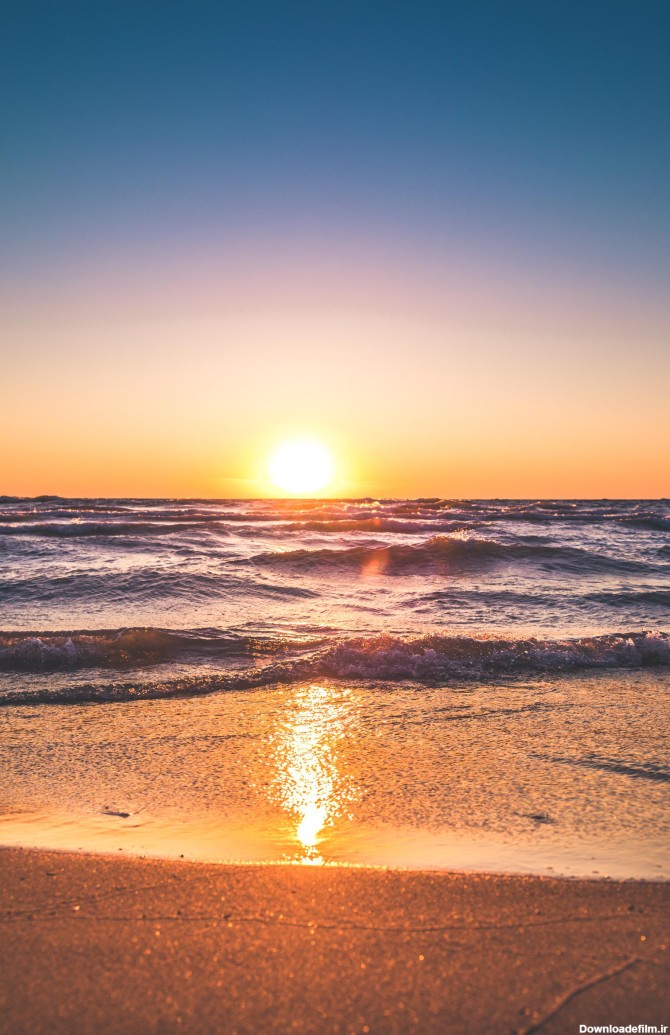 عکس زمینه منظره اقیانوس در هنگام غروب خورشید پس زمینه | والپیپر گرام